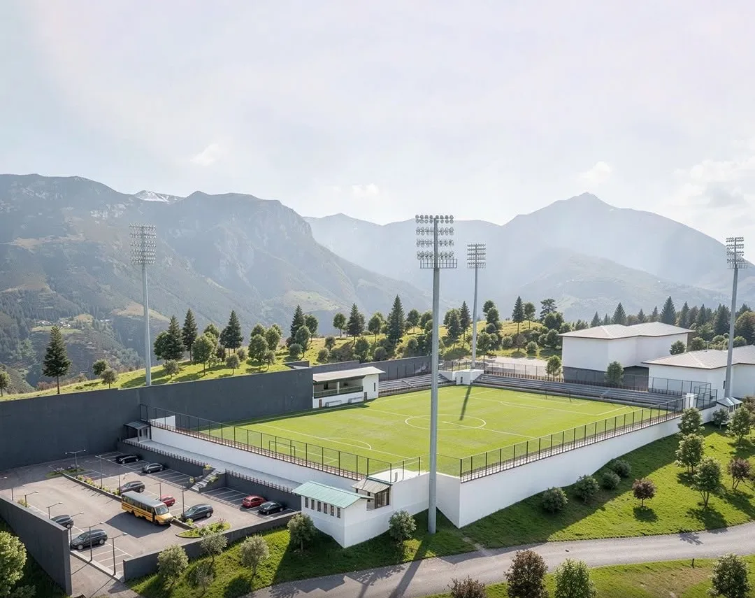 Aerial view of the Gedu College stadium approach, showing the parking area, perimeter wall and spectator galleries