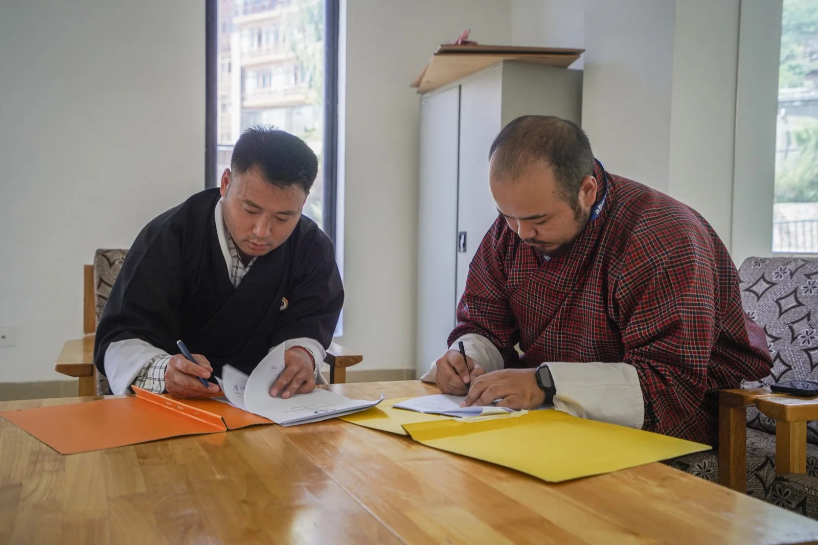 Drangpon Tenzin and Sameer Pradhan signing the Service Agreement on 7th August 2026