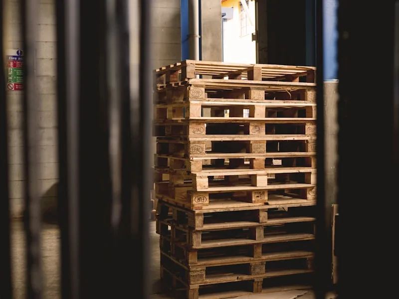 Palletised industrial cargo staged in a warehouse