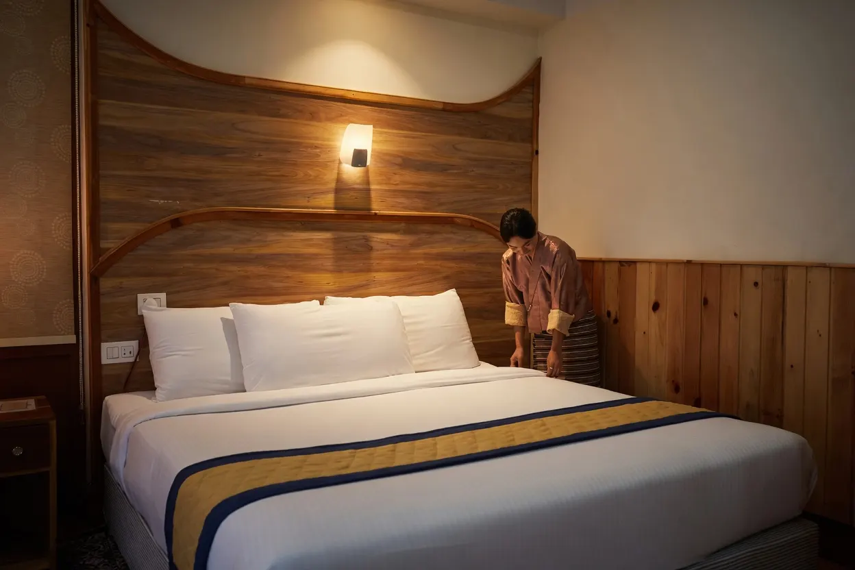 A guest room at Norbu Lingka Resort being prepared for arrival