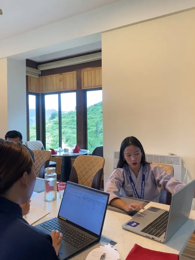 An aBit trainer working through the system with Norbu Lingka Resort staff during the on-site session