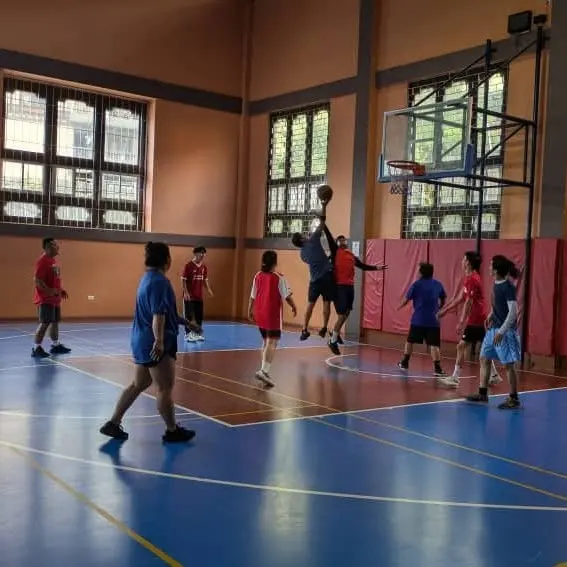 A basketball game in progress on an indoor court