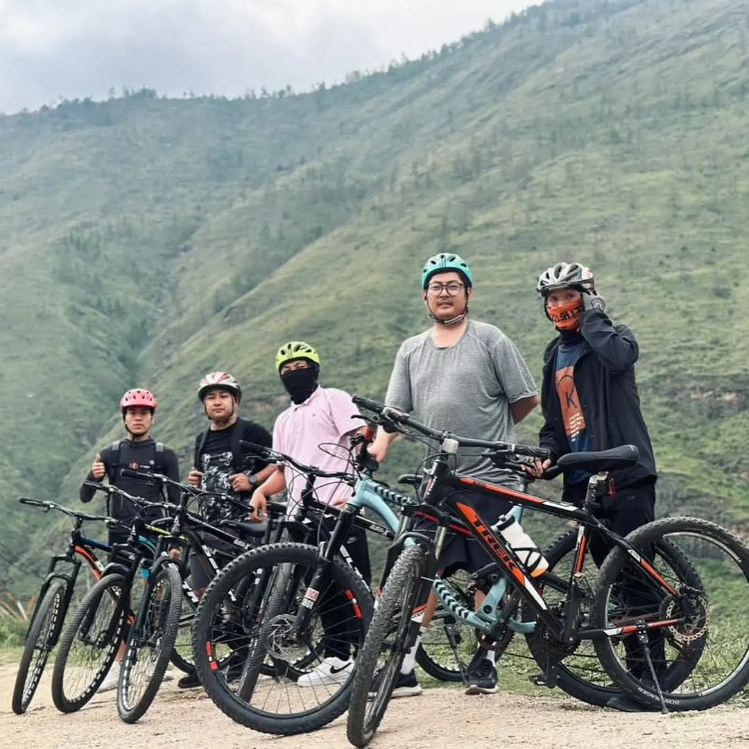 Five of the team out on a mountain-bike ride in the hills