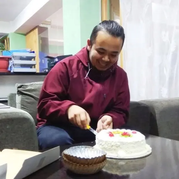 Cutting a cake in the office